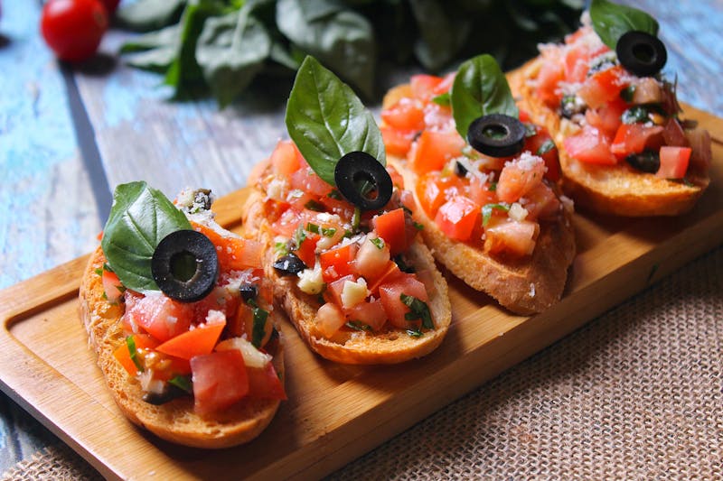 Bruschetta — toasted bread with tomato, basil, olive oil