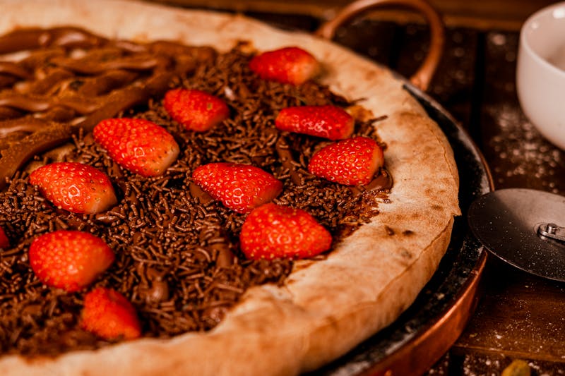 Nutella Pizza dessert — sweet pizza dough, Nutella, strawberries